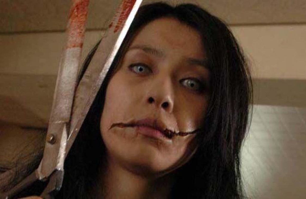 Carved Slit Mouthed Woman