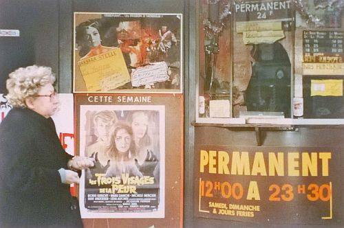 Outside of grindhouse theater with movie posters