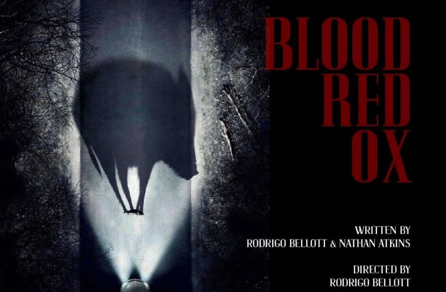 Movie poster for Blood-Red Ox showing a car with headlights highlighting a fallen animal in the road